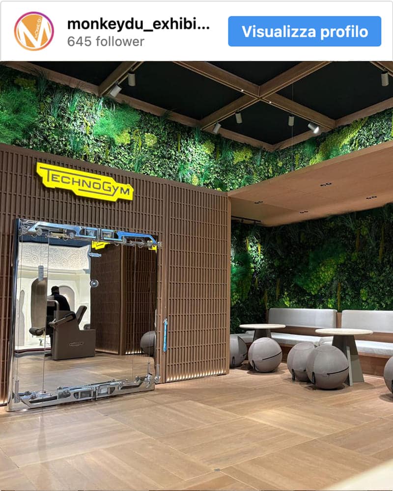 Exhibition stand setup with custom preserved vegetation walls for Technogym in Paris